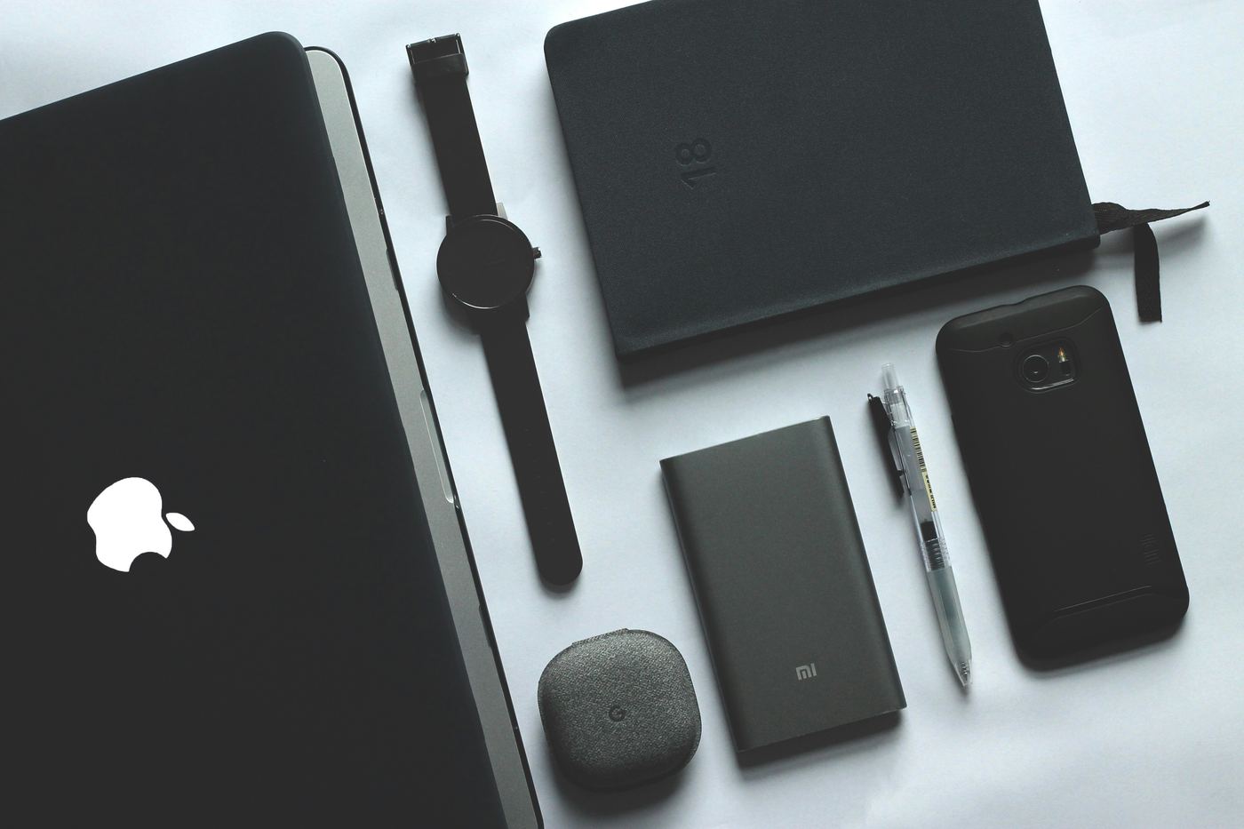 user receiving coordinated messages on a laptop, phone (SMS), and smartwatch - advanced marketing automation