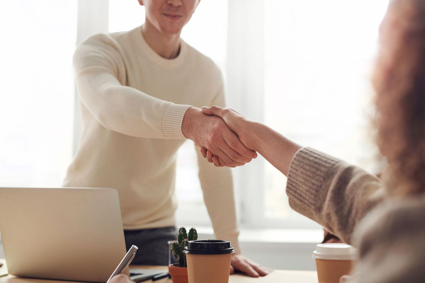 A person reviewing a checklist for selecting a consultant. A person reviewing a checklist for selecting a consultant.
